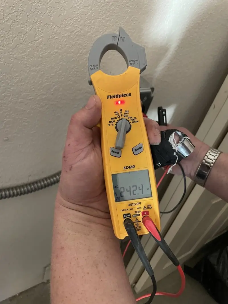 Voltage testing with clamp meter during Ceiling Fan Installation in Linda